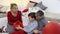 Merry christmas, happy family at home, parents give Christmas present to their surprised and curious son near the illuminated and