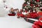 Merry christmas and happy holidays,  children near the christmas tree with wrapped gift packages and musical instruments, in the