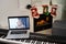 Merry Christmas and a happy. new piano and laptop at christmas time