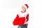 Merry christmas. Happy New Year. Caucasian young schoolboy in Santa costume holds a red Christmas box