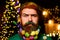 Merry Christmas and Happy new year. Christmas beard decoration. Serious bearded man with decorated beard. Bearded man