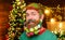 Merry Christmas and Happy new year. Christmas beard decorations. Smiling bearded man with decorated beard. Happy bearded