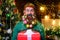 Merry Christmas. Happy New year. Christmas beard style. Smiling bearded man with stylish decorated beard hold Christmas