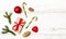 Merry Christmas and Happy New Year composition. Christmas gift, balls, lollipops; pine cones, fir branches on wooden white