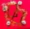 Merry Christmas and Happy New Year. Flat lay photo with golden mockup photo frames and Christmas decorations on bright red backgro