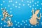 Merry Christmas and Happy New Year greeting card with copy space. Snowman and lantern on a blue background