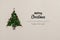 Merry Christmas and happy new year greetings in vertical top view cardboard with natural eco decorated christmas tree