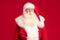 Merry Christmas and Happy New Year! Portrait of jolly Santa Claus with white beard looking at the camera. Xmas sale