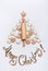 Merry Christmas lettering ,holiday tree made with rolling pin, cookies and gingerbread on white background, top view. Festive layo