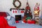 Merry Christmas living room interior with decorated fir-tree, fireplace, wreath, star, cones, bulbs, gift boxes and red plaid