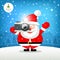 Merry christmas Santa claus hand holding photo camera