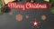 Merry christmas text banner against multiple christmas decorative items on red surface