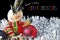 Merry Christmas with Toy Snowman and Baubles on Tinsel