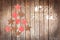 Merry Christmas, tree made with wooden rustic ornaments on wood background