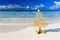 Merry Christmas tree and wishing decoration, in a beach
