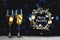 Merry Christmas Typography Art. Two Glasses of Champagne Dark Glow Lights Background