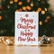 Merry Christmas on white paper, standing greeting card.