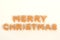 Merry Christmas words from orange balls on white background