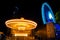 Merry go round and Ferris wheel at night in Asiatique, Bangkok, Thailand.