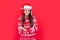 merry xmas. cheerful teen girl in red xmas santa earflap hat in studio. teen santa xmas girl