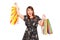 Merry young woman holding shopping bags