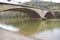 Mertert, Luxembourg - 11 30 2023: Border river Sur with the road bridge at the estuary