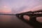 Merto Bridge with old underground train over Dnipro River. Scenic autumn landscape during sunrise