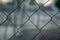 Mesh aluminium wire with defocused background, business concept