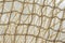 Mesh natural netting fabric close-up, light background