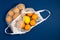 Mesh shopping bag with tangerines, lemons on a blue classic background