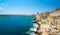 Mesmerising shot of the beautiful town of Valletta with ancient buildings and crystal clean water