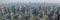 A mesmerising view of the skyscrapers of Shanghai, China, from the Wangpu River. High-rise buildings and bridges are reflected in