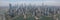 A mesmerising view of the skyscrapers of Shanghai, China, from the Wangpu River. High-rise buildings and bridges are reflected in