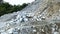 The mesmerizing aerial footage unveiled the road construction site on the highland, with rocks scattered around, capturing the