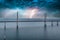 Mesmerizing aerial view of the bridge between Denmark and Sweden under the sky with lightning