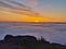 Mesmerizing display of a sunset captured in a foggy sky from a height