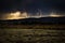 Mesmerizing lightning storm over the green field in Jackson Hole