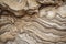 Mesmerizing Marble-Like Rock Texture with Swirling Stripes and Veins