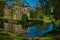 Mesmerizing scene of a pond with the Coloma castle in the background in Belgium