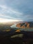 Mesmerizing scene of a river between forest and hill under the cloudy sky