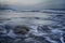 Mesmerizing seascape with wavy water on the gloomy sky background