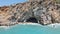 Mesmerizing shot of a coastal cave located in a rocky area and 
crystal-clear water