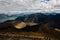 Mesmerizing shot of huge mountains  with tourist at daytime