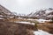 Mesmerizing shot of a meltwater and snow on the mountains in Chugach State Park, Alaska