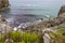 Mesmerizing shot of a rocky seacoast in the daytime