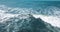 Mesmerizing shot of a surfer at the top of the wave in El Paredon beach in Monterrico, Guatemala