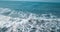 Mesmerizing shot of a surfer at the top of the wave in El Paredon beach in Monterrico, Guatemala