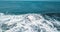 Mesmerizing shot of a surfer at the top of the wave in El Paredon beach in Monterrico, Guatemala