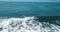 Mesmerizing shot of a surfer at the top of the wave in El Paredon beach in Monterrico, Guatemala