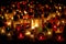 A mesmerizing sight of various candles glowing in the dark, evoking a sense of warmth and tranquility